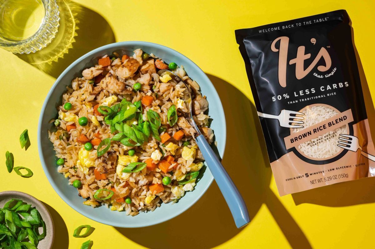 Easy fried rice made with It’s That Simple rice blend next to its pouch