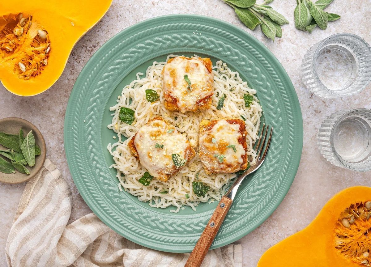 Shrimp over It’s That Simple spaghetti on a green plate